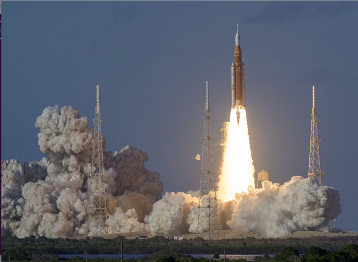 A rocket launches from a pad