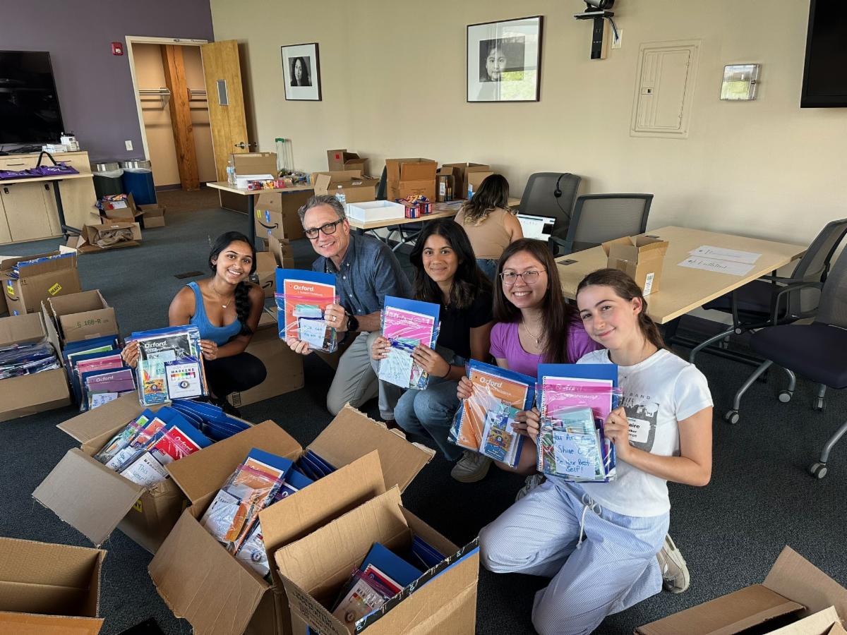 Sareena and colleagues prepare packages for delivery for the ReWrite It Project
