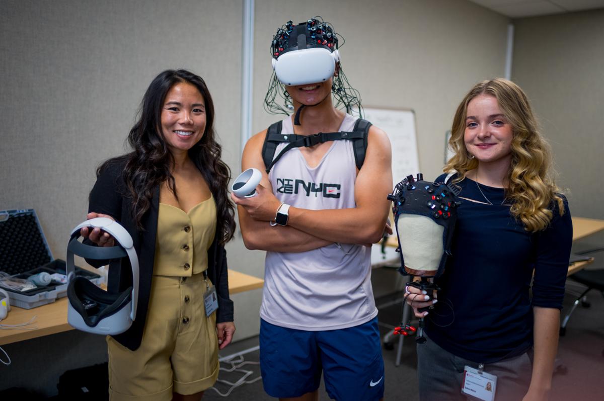Images of mentor and two students posing with various VR headsets