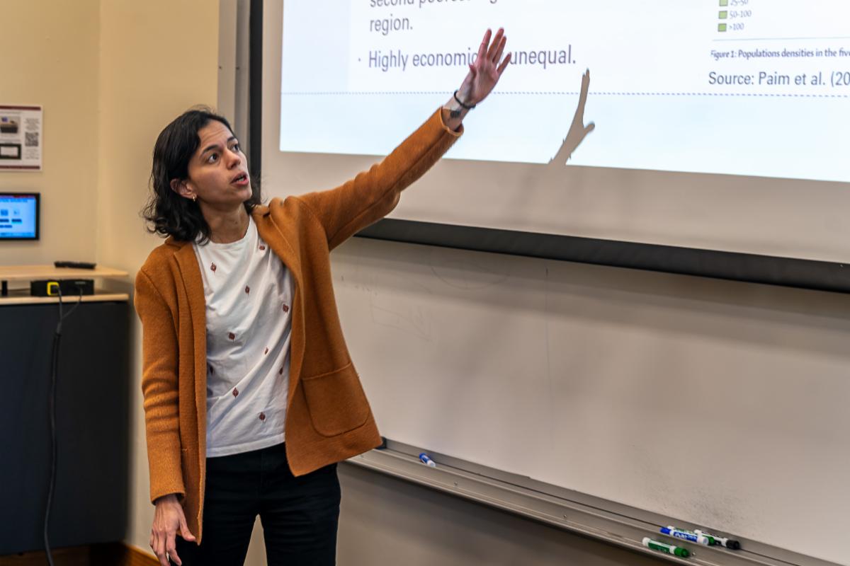 Dr. Serna points to something on her powerpoint in HumBio 123G