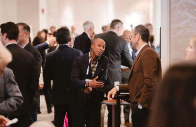 Two attendees in conversation at the Boston CEO reception