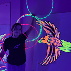 A photo of children from the Creighten area participating in a hoop-dancing course.