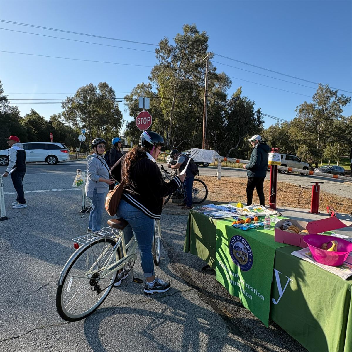 A bicyclist reading a flyer at the energizer station