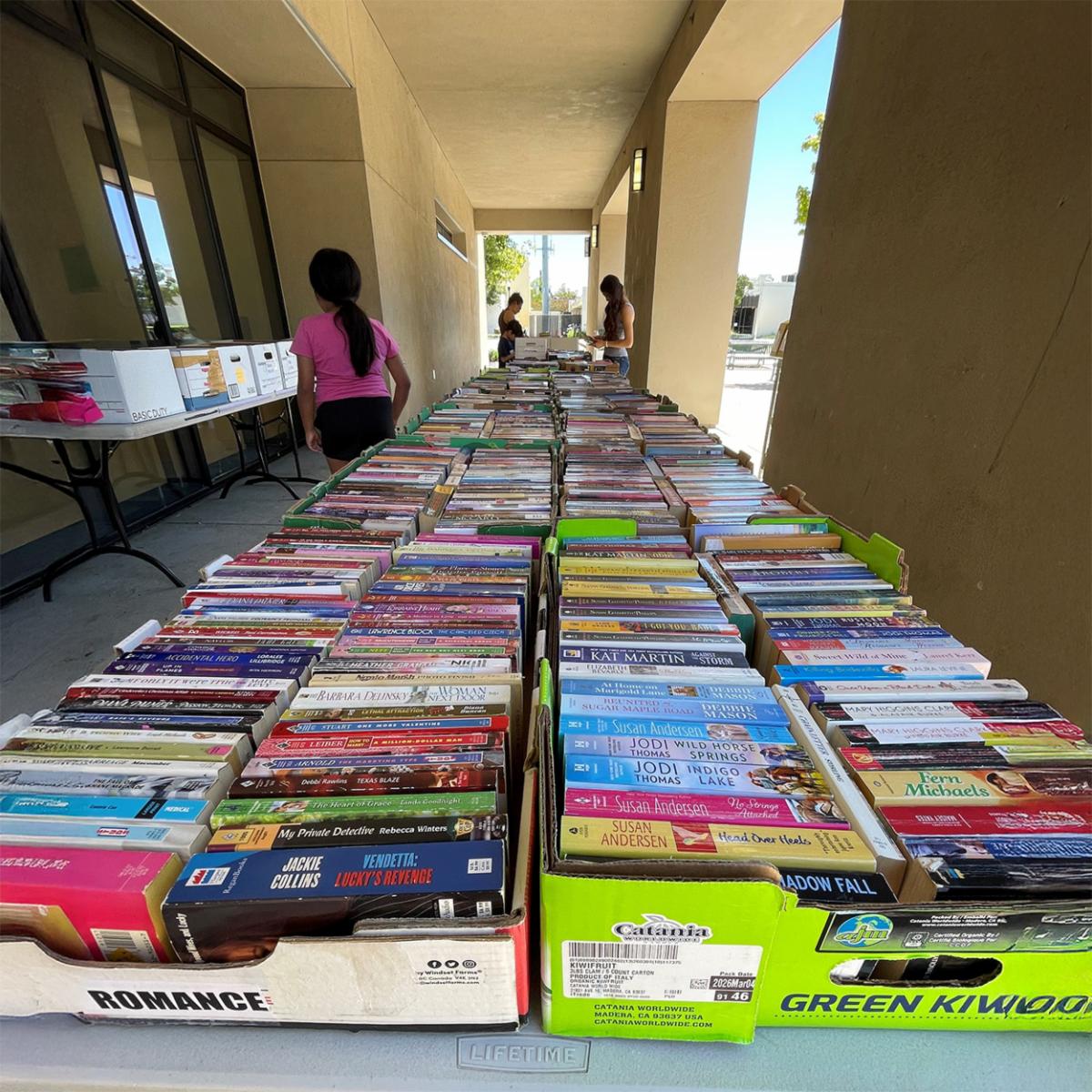 books on a table, outside the library