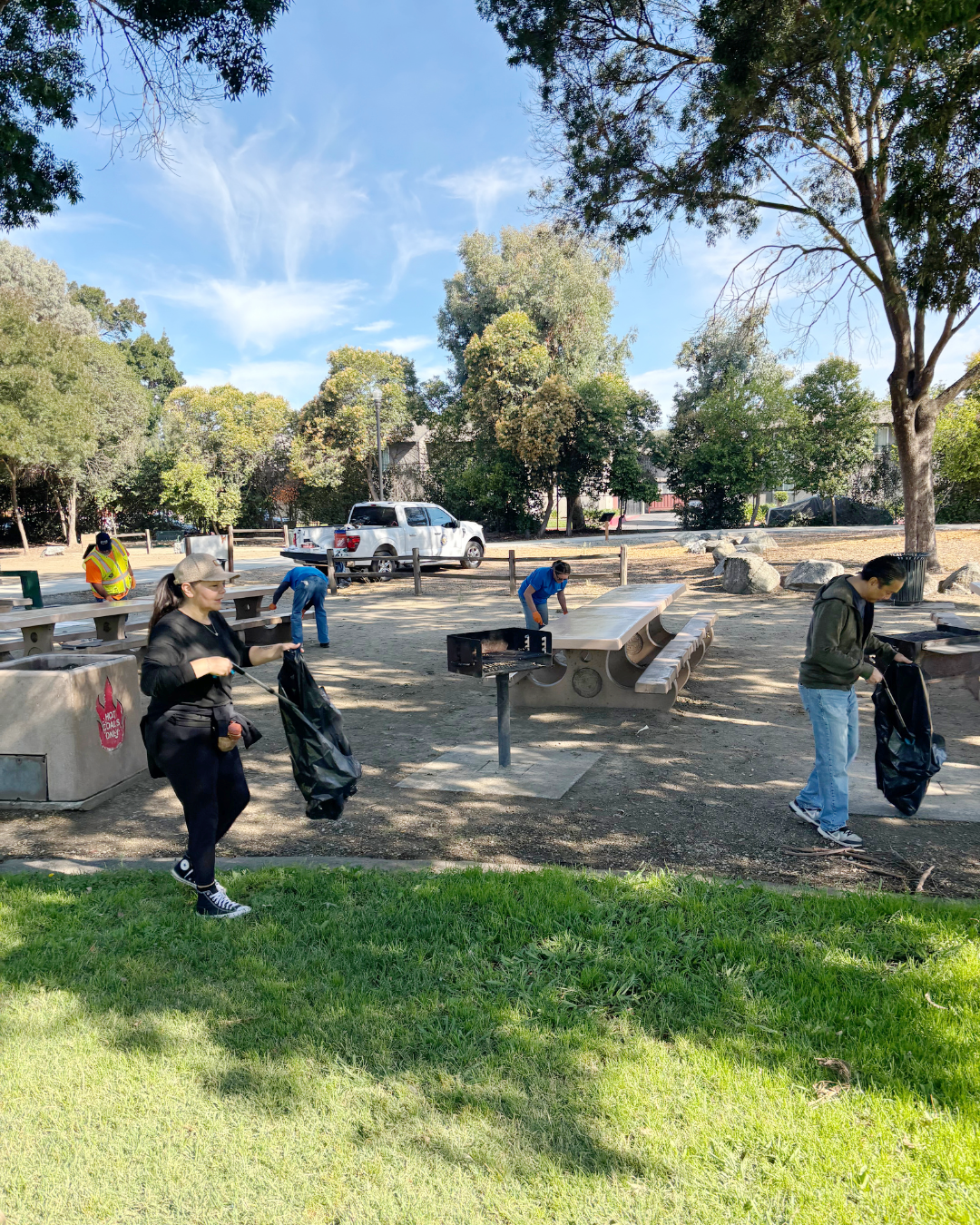 volunteers picking up trash at San Ysidro Park