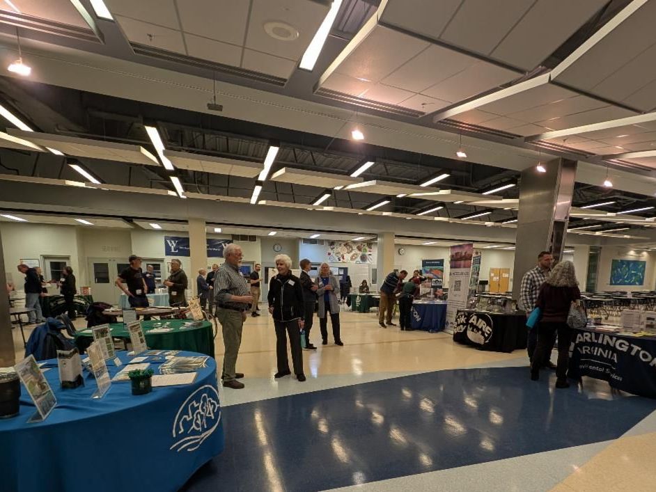 photo exhibitors tables and attendees at Washington-Liberty HS Cafeteria
