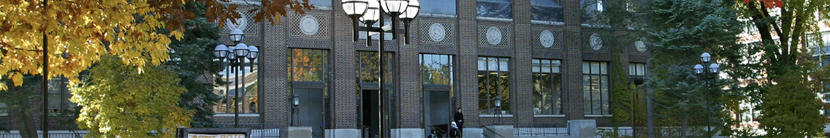 Narrow strip of the front of the Hatcher Library in autumn.