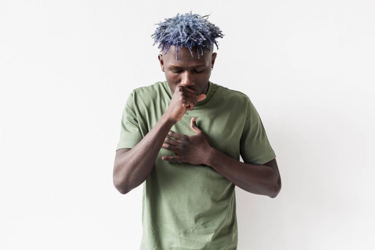 Illustration showing a person practicing breathing exercises and managing cough symptoms, symbolizing respiratory care.