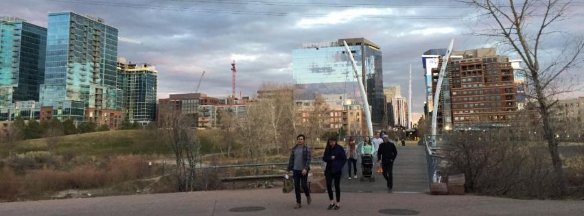 people walking on a bridge in Denver