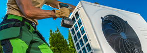 person installing heat pump