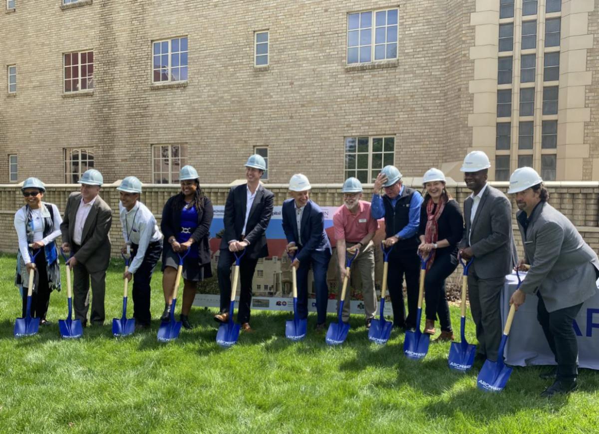People holding shovels attending a groundbreaking celebration for Mosaic Community Campus