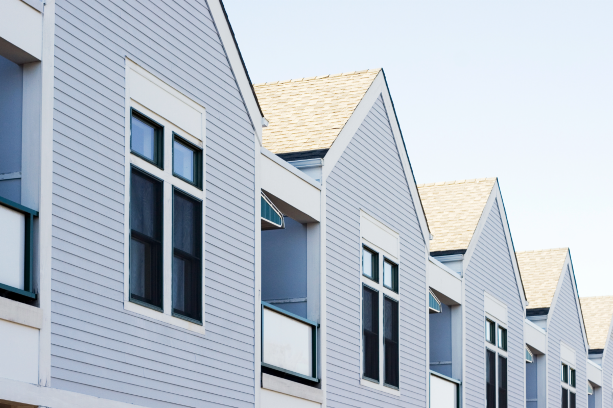 Photo of grey and white affordable housing units