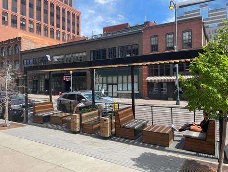 A below curb outdoor patio with structures and enclosures
