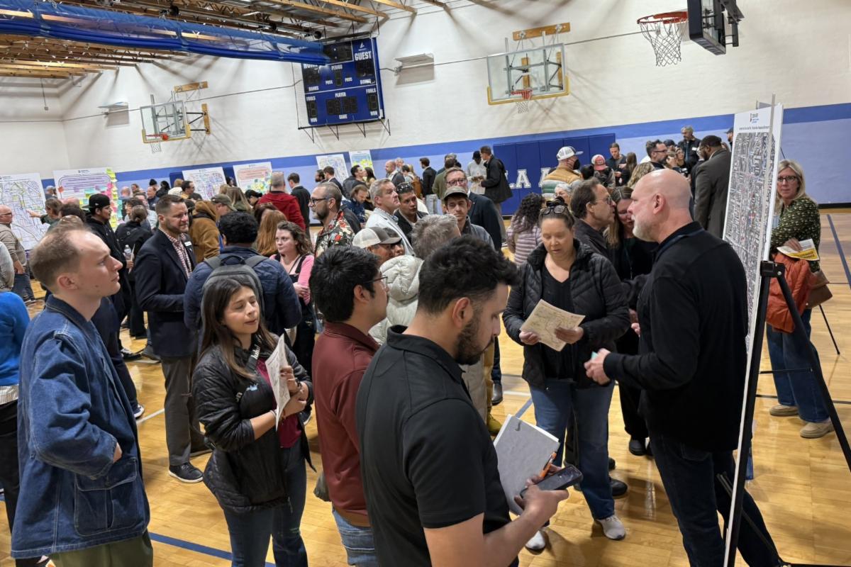 Attendees look at a board at first Burnham Yard community open house