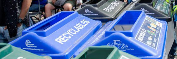 Row of trash and recycling cans