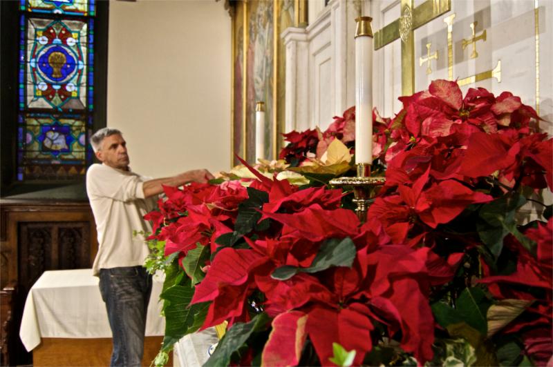 Michael Ruggiero, a talented arborist and CCC friend, decorating the church in 2015.