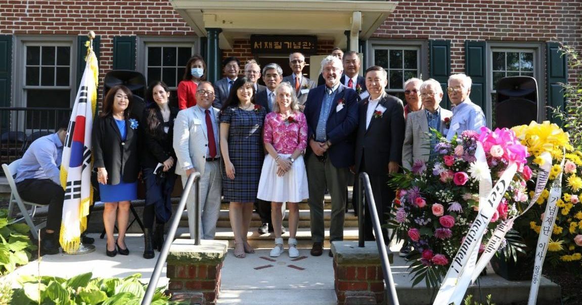 Guests and speakers in front of the Jaisohn Memorial House