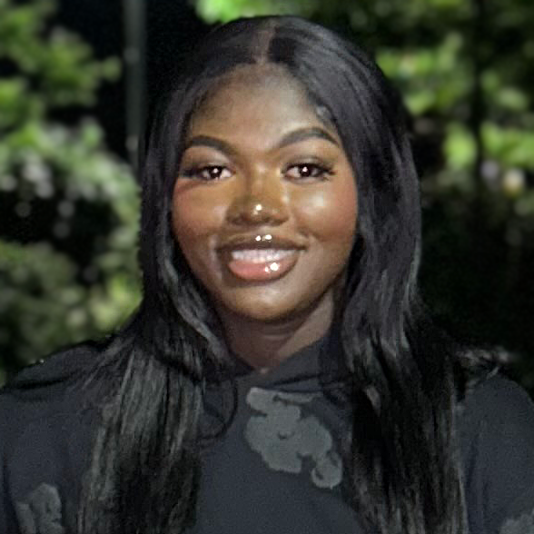 Fatima smiling wearing black sweatshirt