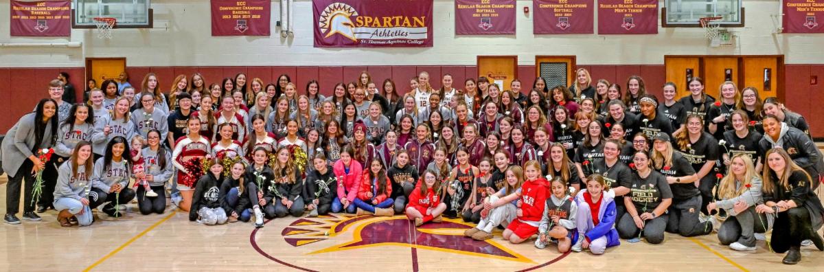 National Girls and Women in Sports Day group photo in basketball court