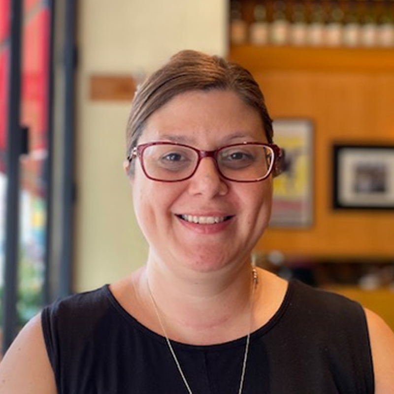 Francesca wearing glasses smiling