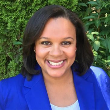 Shannon smiling wearing blue sweater