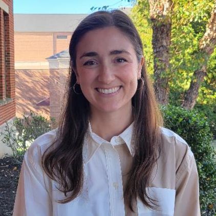 Sarah smiling outside