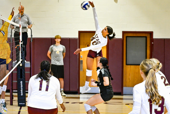 track event high jump mid air and student mid jump on volleyball court