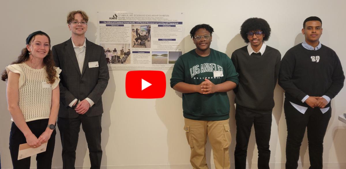 five students standing and smiling next to poster about virtual reality helping children learn
