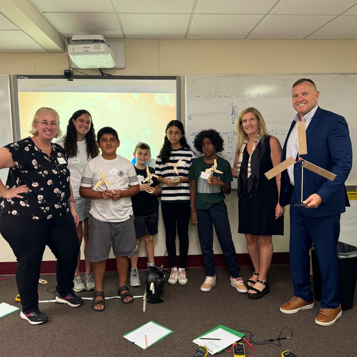 STEAM Circuit Camp photo of counselor and student building circuit board in classroom