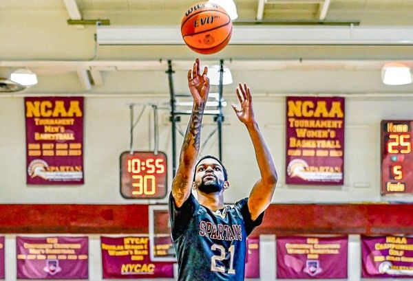 jamal scoring point shooting basketball into hoop