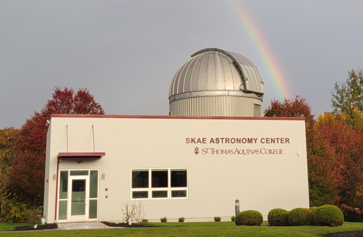 SKAE building with rainbow in background