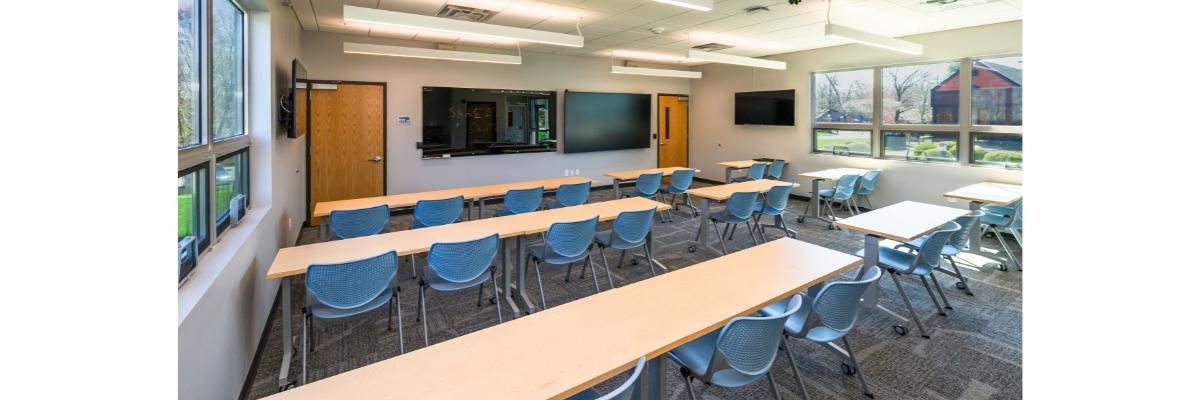 Schematic of front room where there will be concessions and ticketing a golf simulator office and whiteboards planning rooms and bathrooms