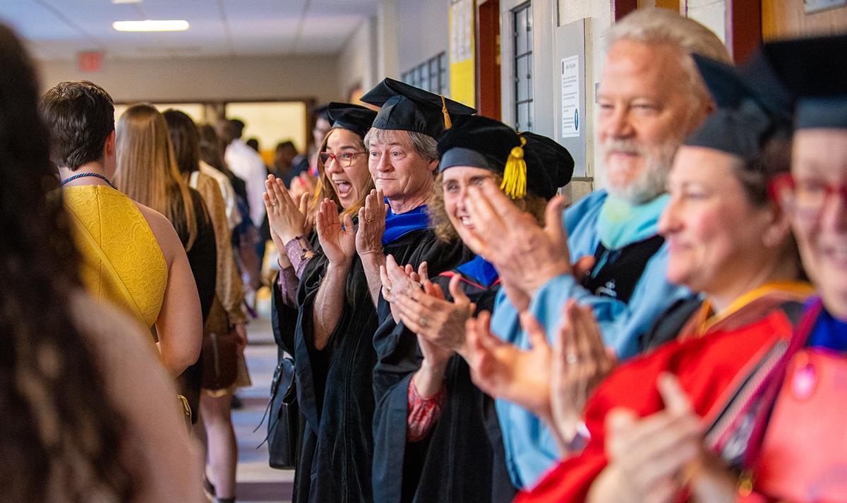 honors convocation faculty clapping wearing regalia