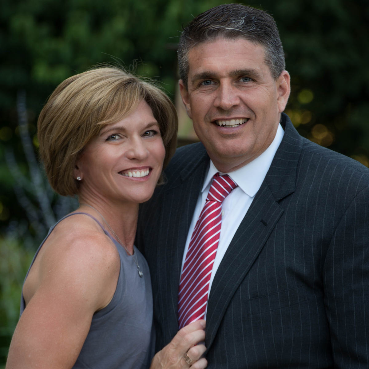Peter and Leslie smiling wearing formal wear