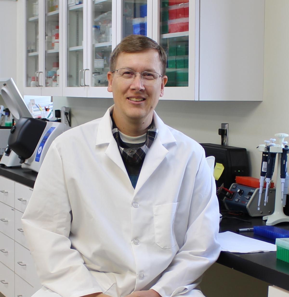 Group of people in suits standing in front of a modern building