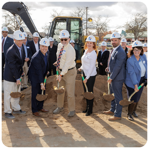 Dutch Point ground breaking event. People wearing hard hats and shoveling dirt.