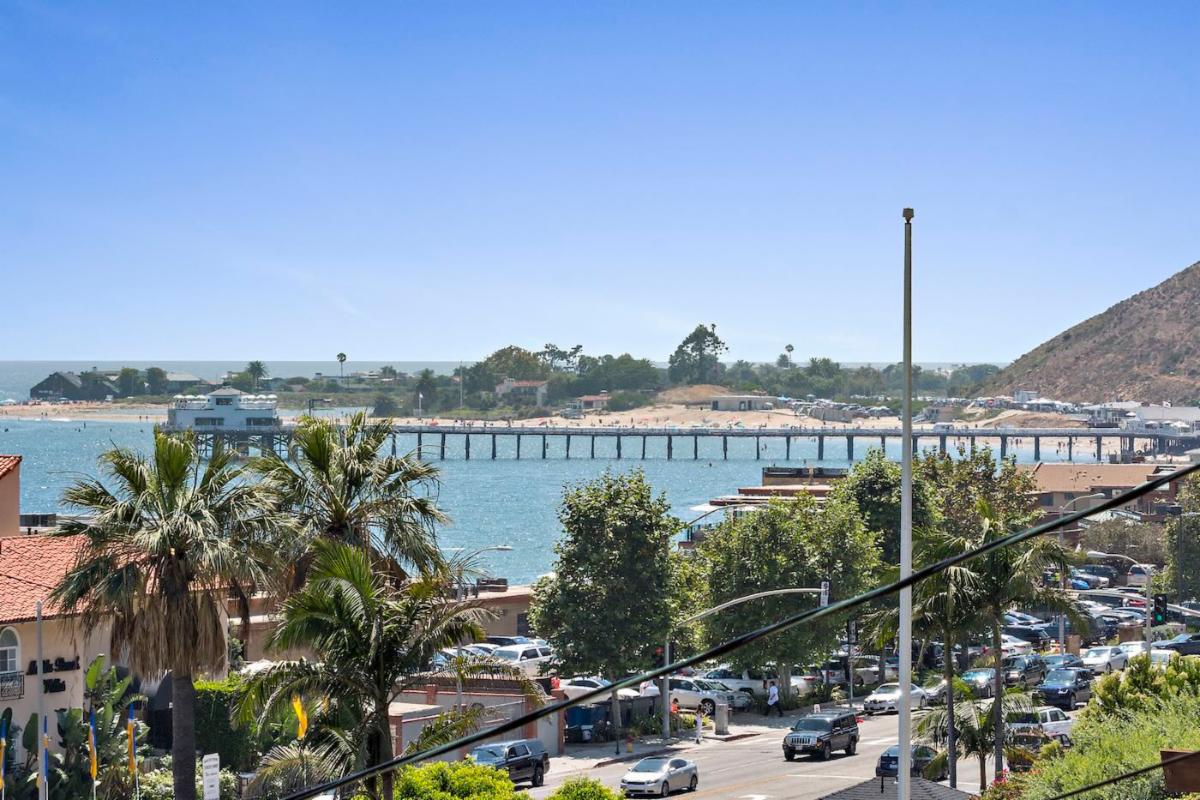 Carbon Beach Malibu with Nobu and Malibu Pier along the shoreline on a sunny coastal day.