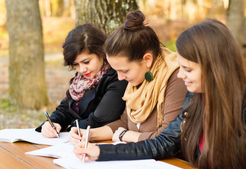 Image of three women studying at a table.