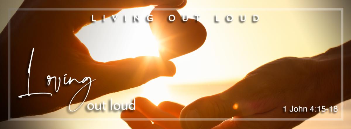 One hand giving another hand a small heart