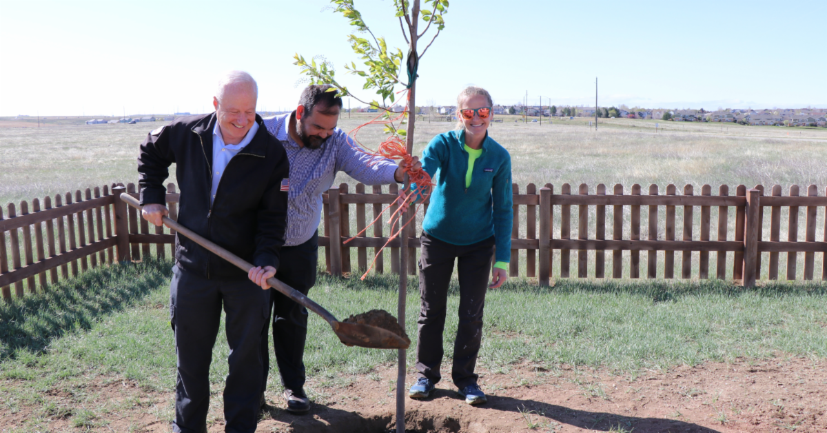 Mayor Coffman, Forestry Manager, Adrian and Forestry Technician, Ashley Fox planting a tree at Plains Conservation Center