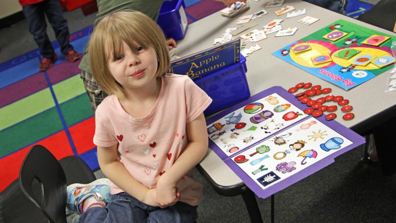 A Pre-K student plays a game