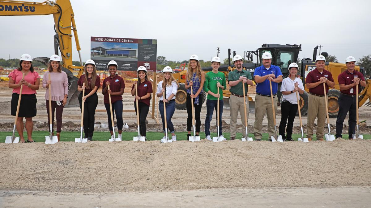 Students and program leads break ground on the aquatics center