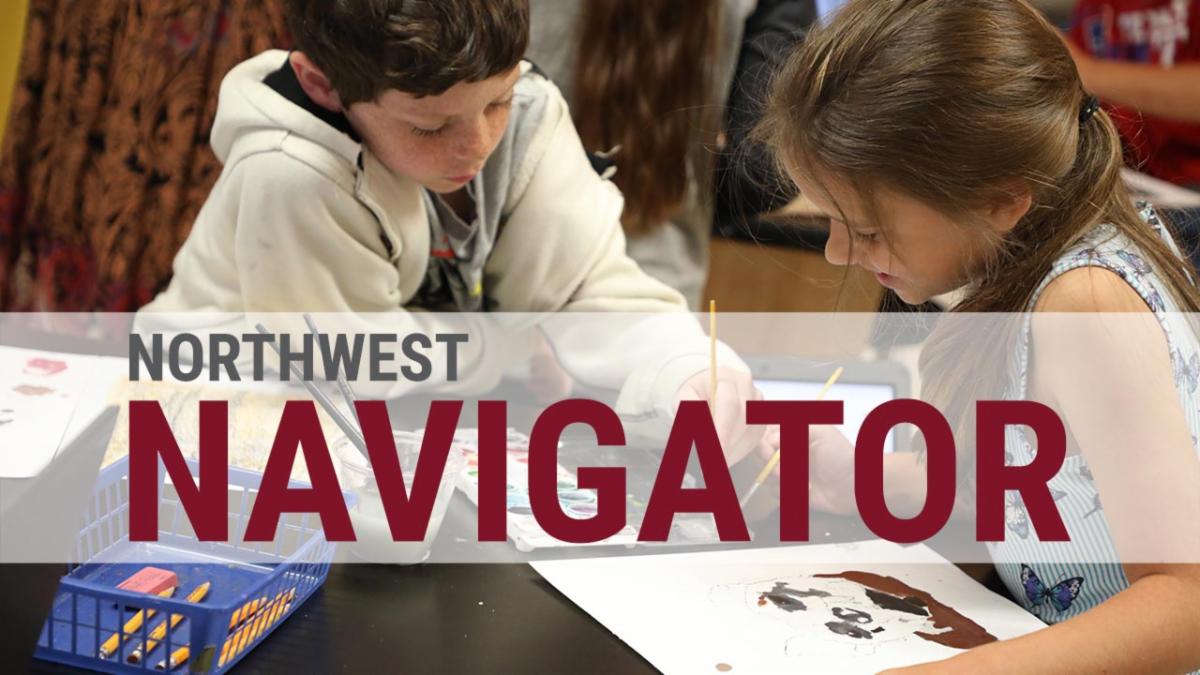 Two students paint dog portraits with the text Northwest Navigator above