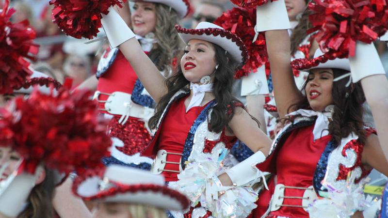 The Northwest Sidekicks perform at a football game