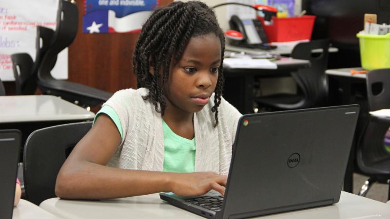 A student uses a Chromebook