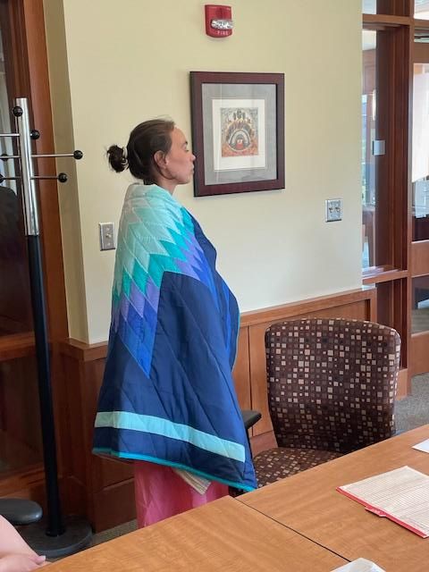 Gabrielle being honored by the Truth and Healing Team with a starquilt.