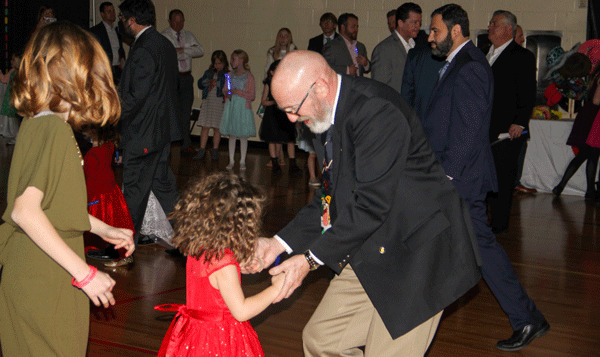Dancing children and adults