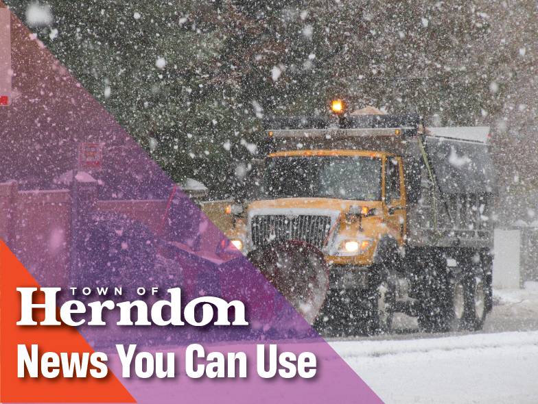 Snow plow works to clear road