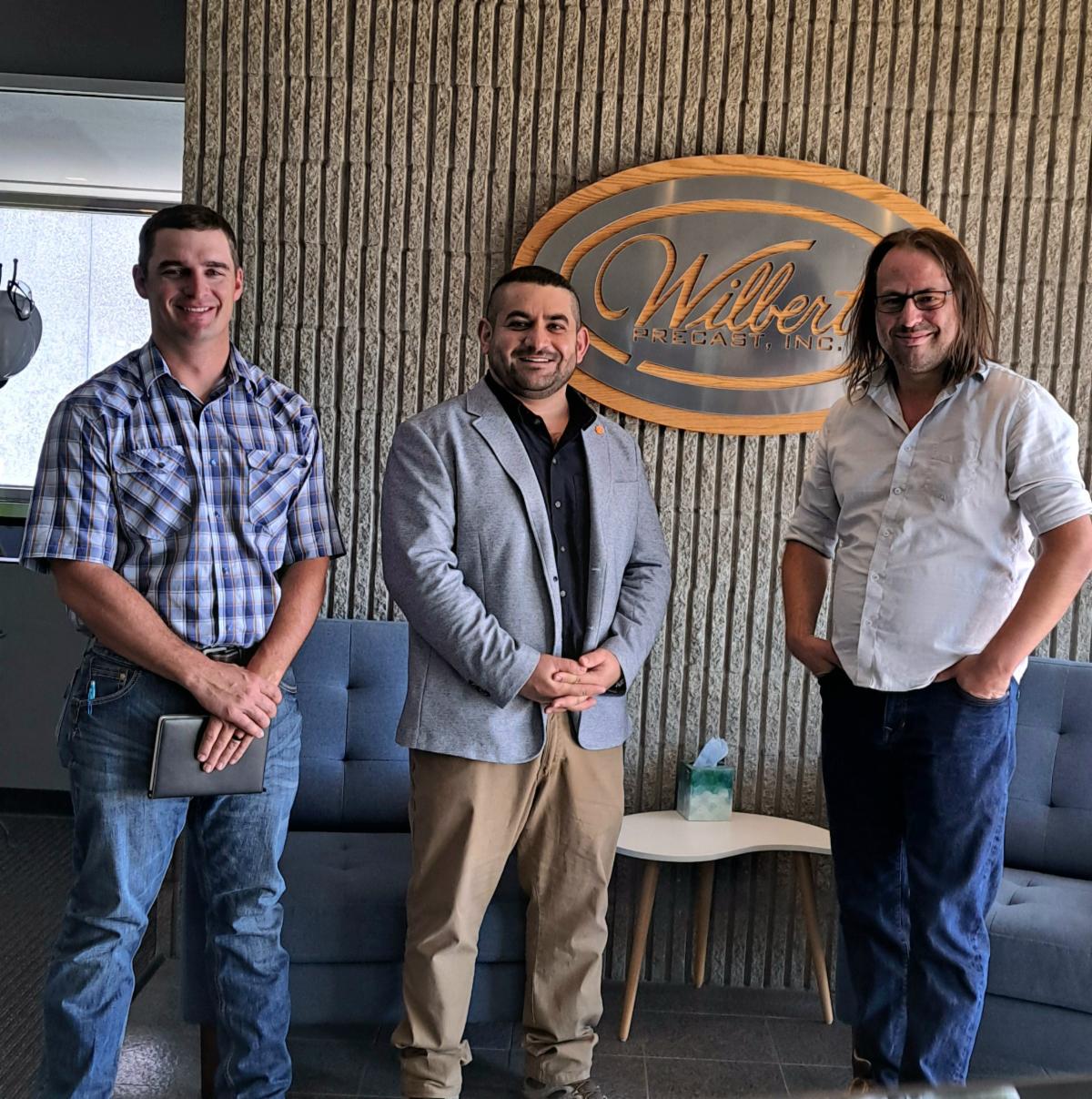 Jared Cantrell Mustafa Mashal and TJ Houk pose for a photo.