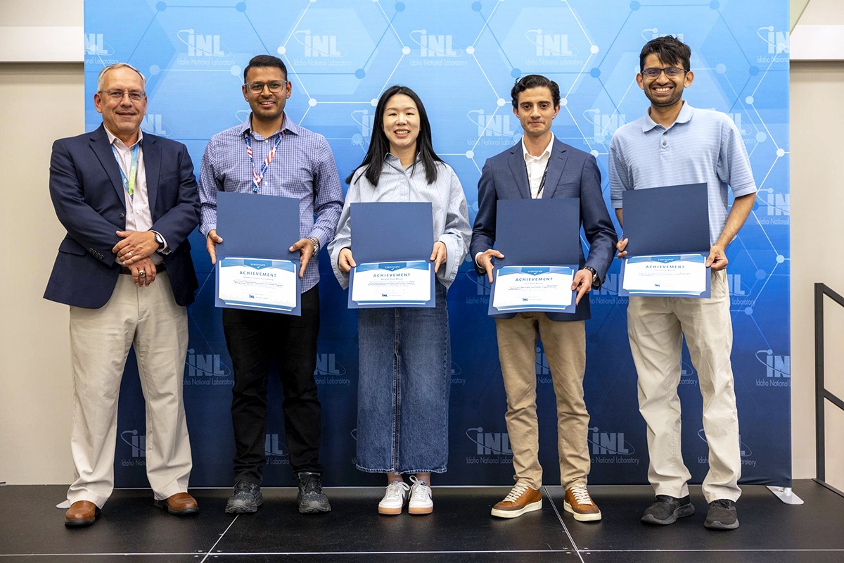 Winners of INLs People's Choice Award at Idaho National Laboratorys Early Career Researchers Association and Postdoctoral Association poster session pose for a photo.